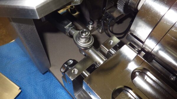 A close up of a Skin Splitter machine with metal parts.