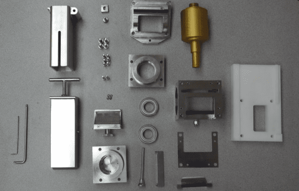 A variety of metal parts are laid out on a table in a Medical Equipment Catalog.