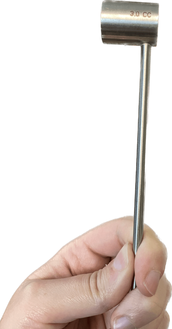 A person's hand holding Stainless Scoops.